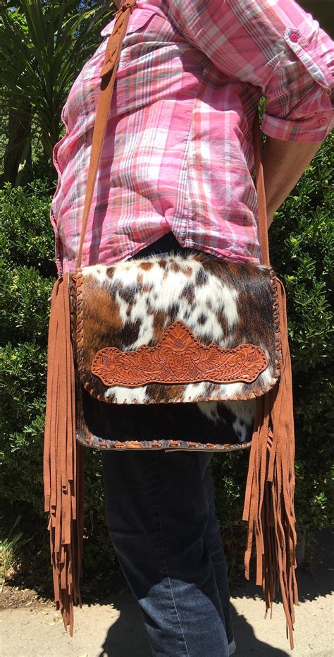 cowhide crossbody purse with fringe.